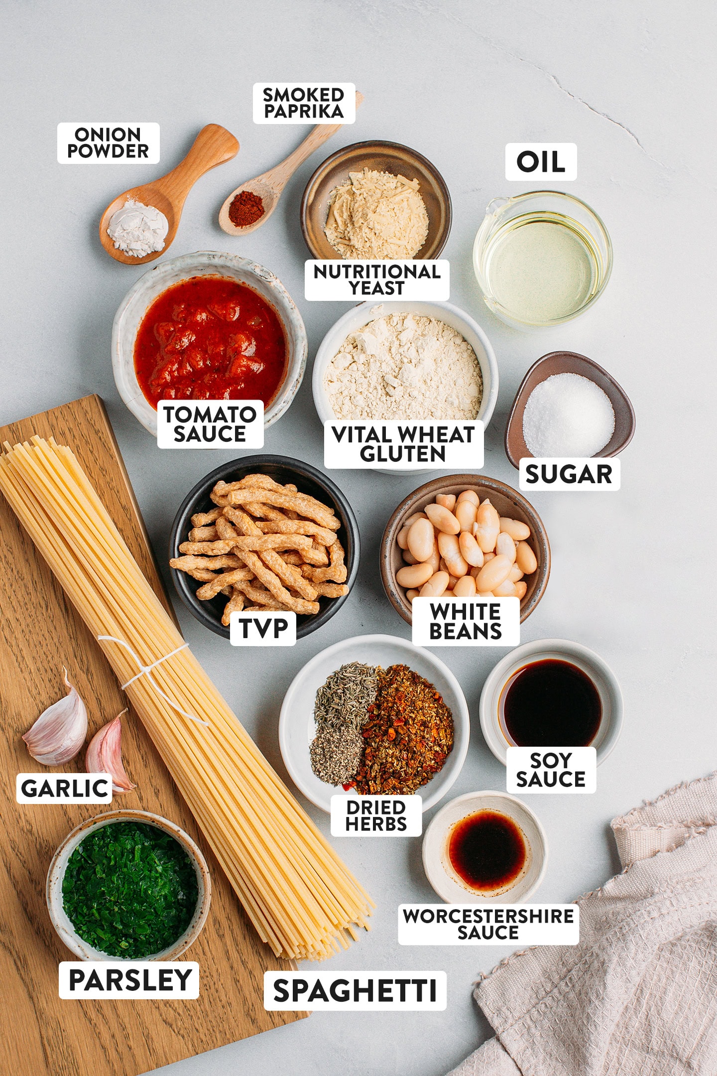 Ingredients like spaghetti, tvp, white beans, vital wheat gluten, and tomato sauce.