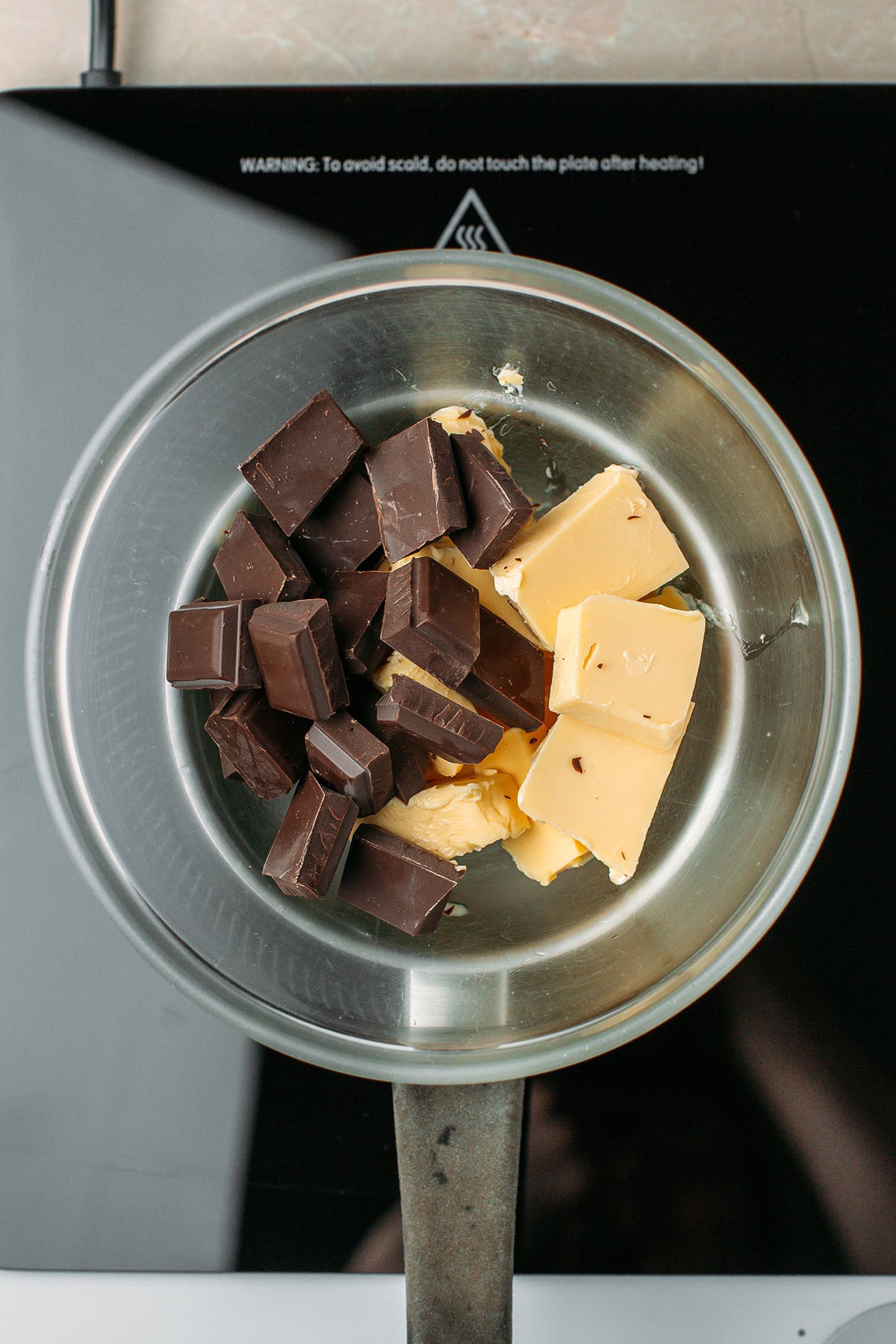 Dark chocolate and diced vegan butter in a double boiler.